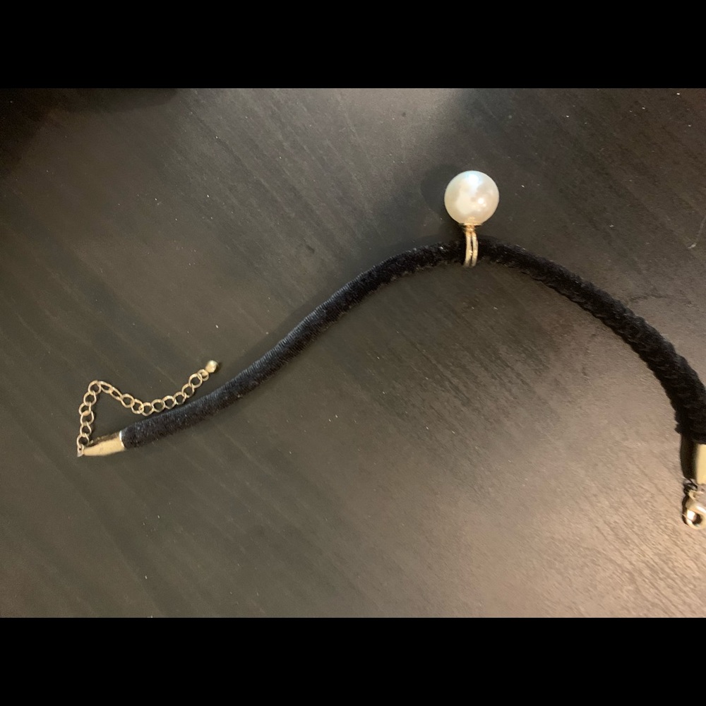 Velour black string and pearl , designer piece